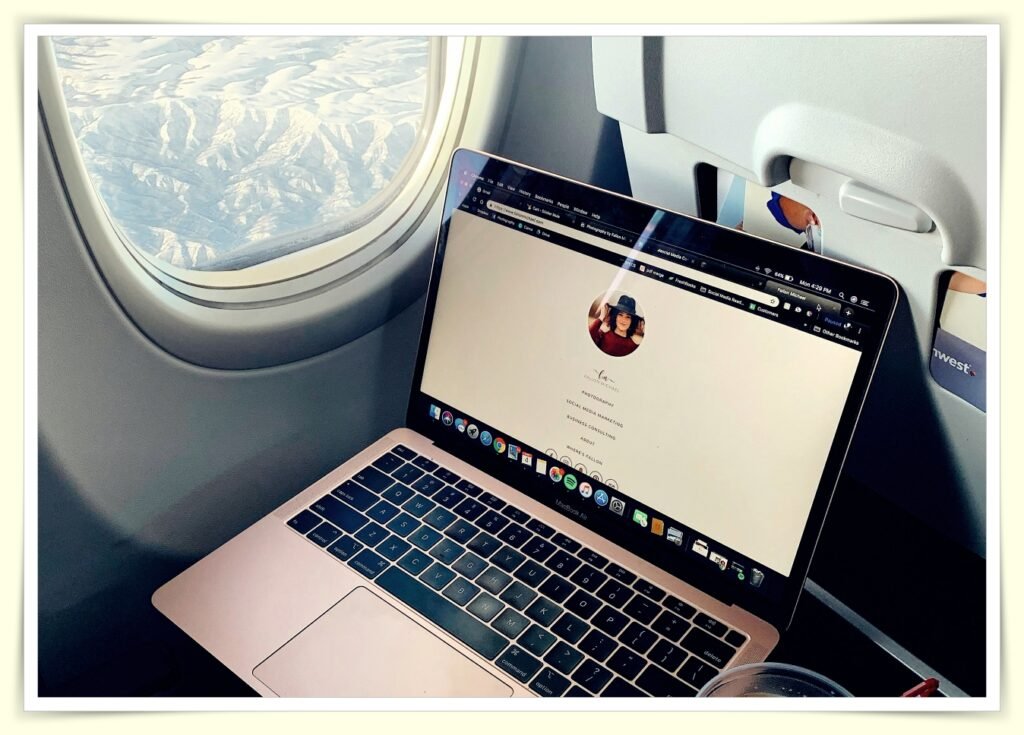 person searching and booking cheap flights on laptop with coffee