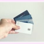 person managing credit card debt and savings