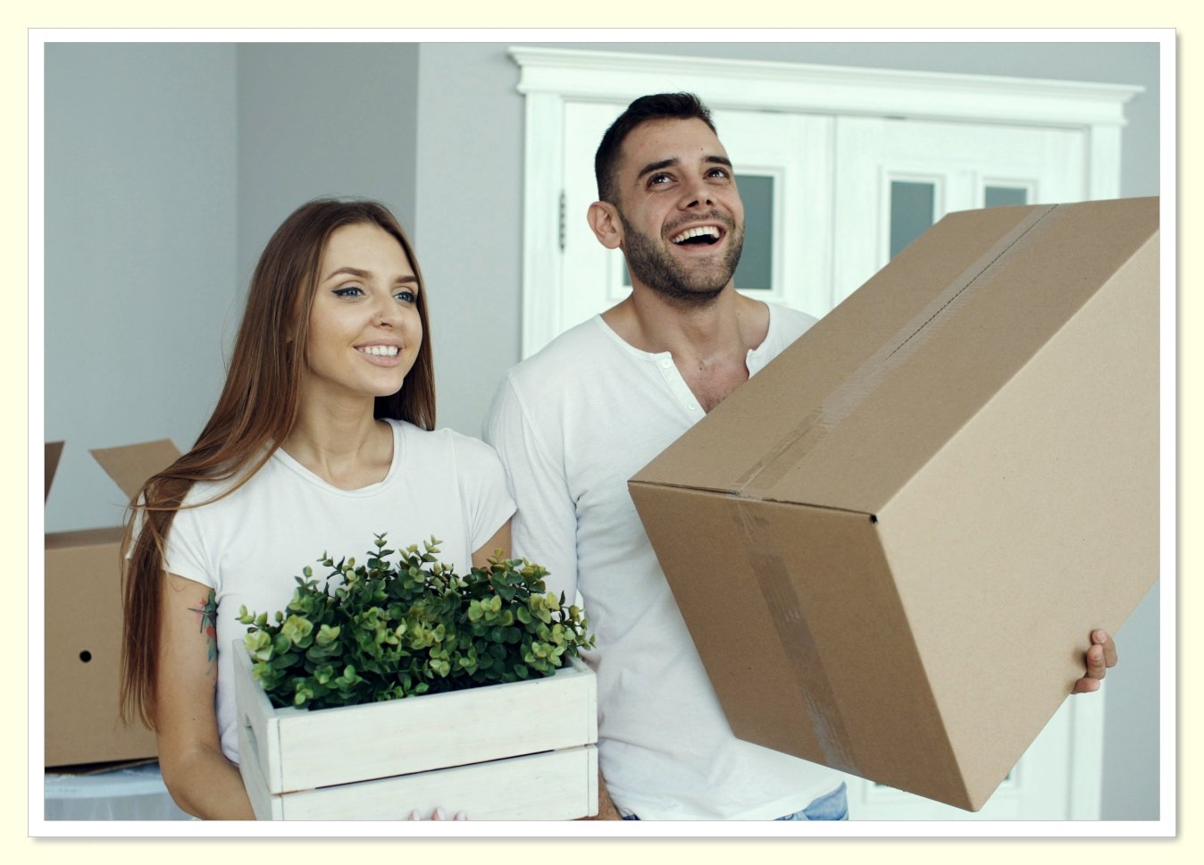 young person moving into first apartment with cardboard boxes