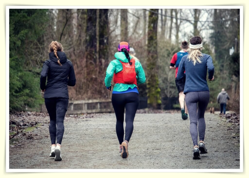 person running outdoors in park as free gym membership alternative