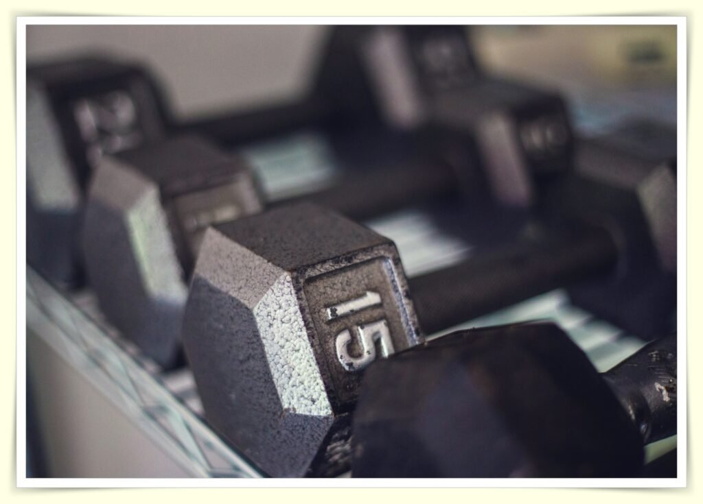 budget home gym setup with dumbbells and resistance bands