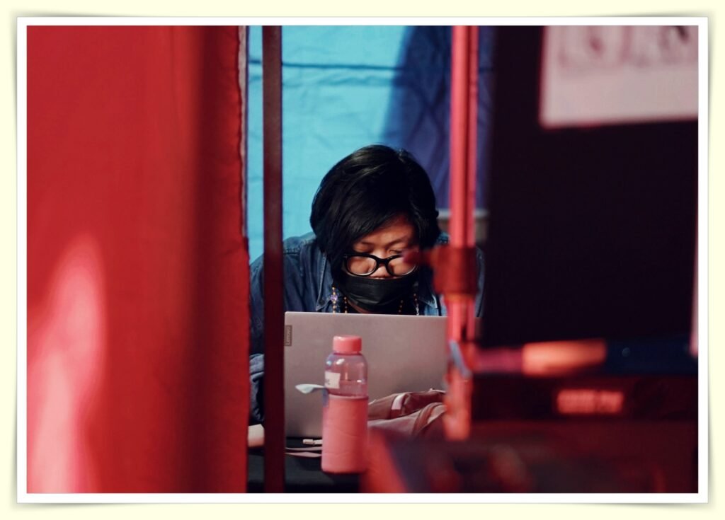 person shopping on a budget in grocery store with cart