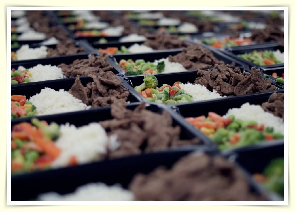 organized meal prep containers in kitchen to reduce food waste