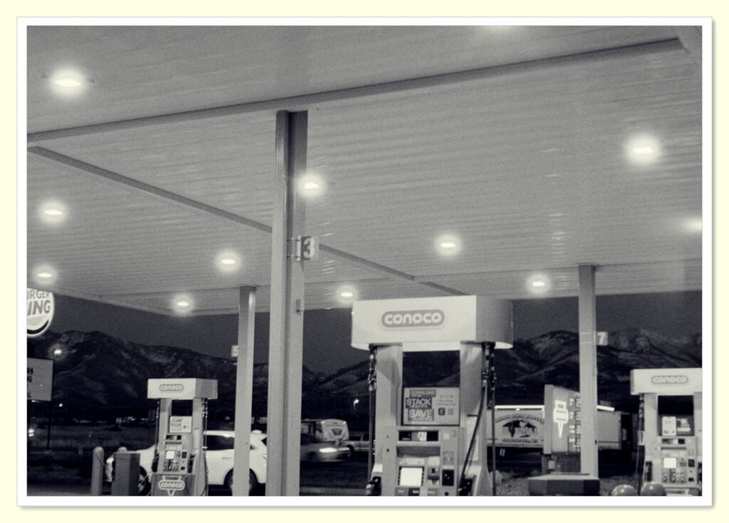 person refueling car at gas station to save money on gas