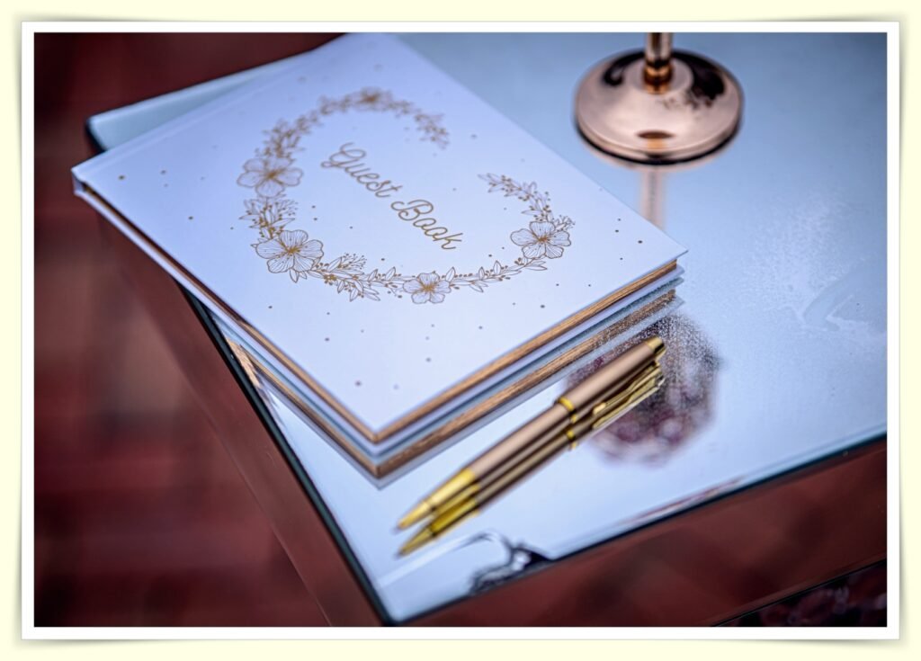 couple planning wedding budget together with notebook and laptop