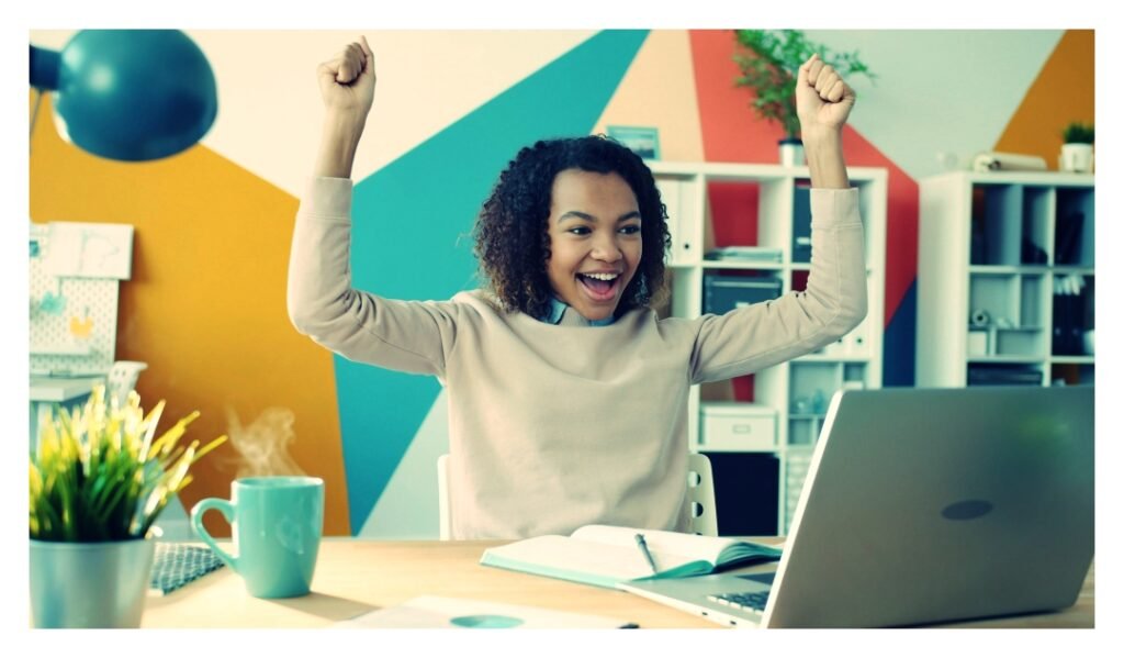 young adult celebrating a 700 credit score
