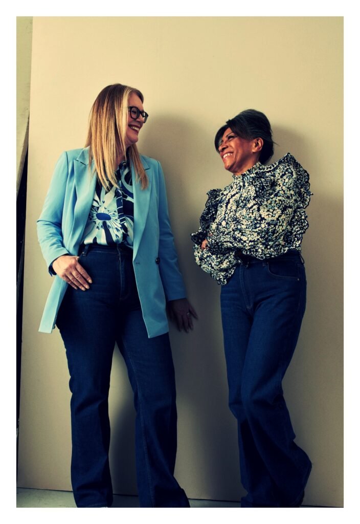 two coworkers discussing aggressive savings rate in their 40s